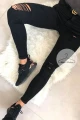 Czarne spodnie jeansowe z dziurami i przetarciami Black